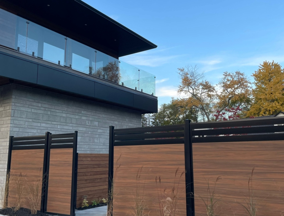 A mocha vinyl fence installed by Modern Decks and Vinyl Fences.