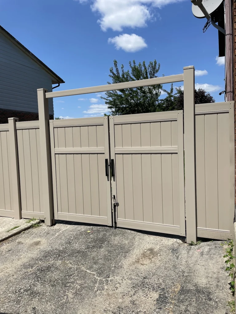 Beige vinyl gate at a residential front entrance in Whitby