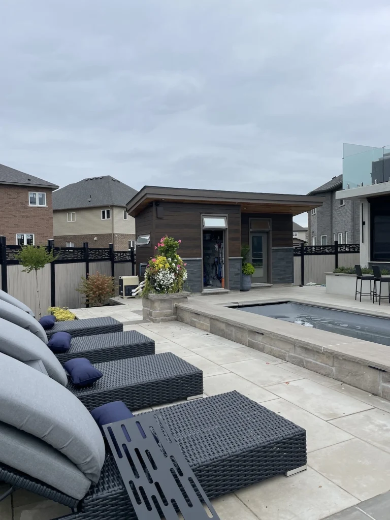 Beige vinyl fence surrounding a backyard pool in Stoney Creek