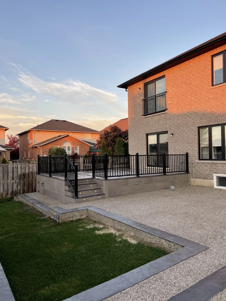 Custom deck with black aluminum railings on a Stoney Creek home.