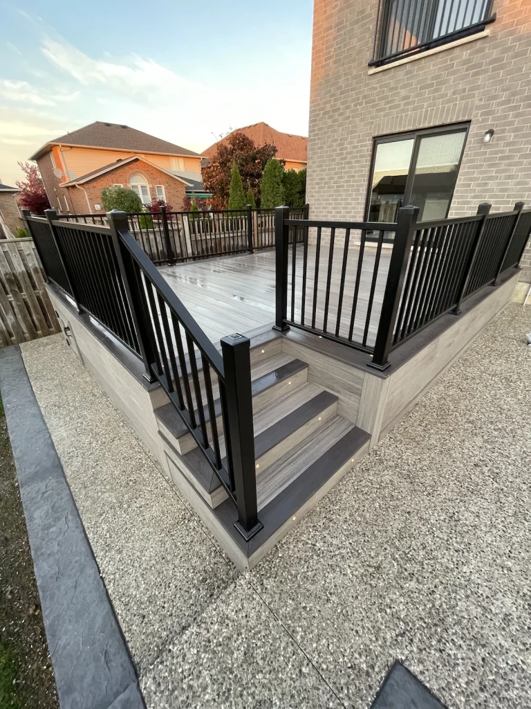 Wide-angle view of a custom deck with black railings in Stoney Creek.