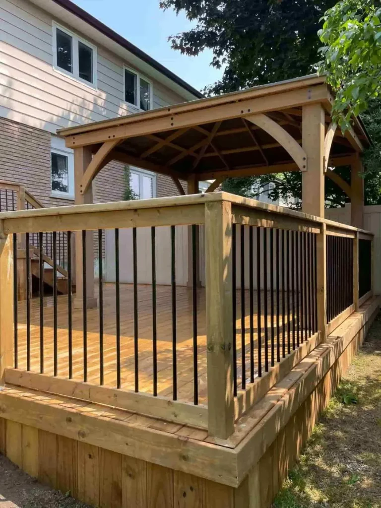 A deck with gazebo completed by Modern Decks & Vinyl Fences.
