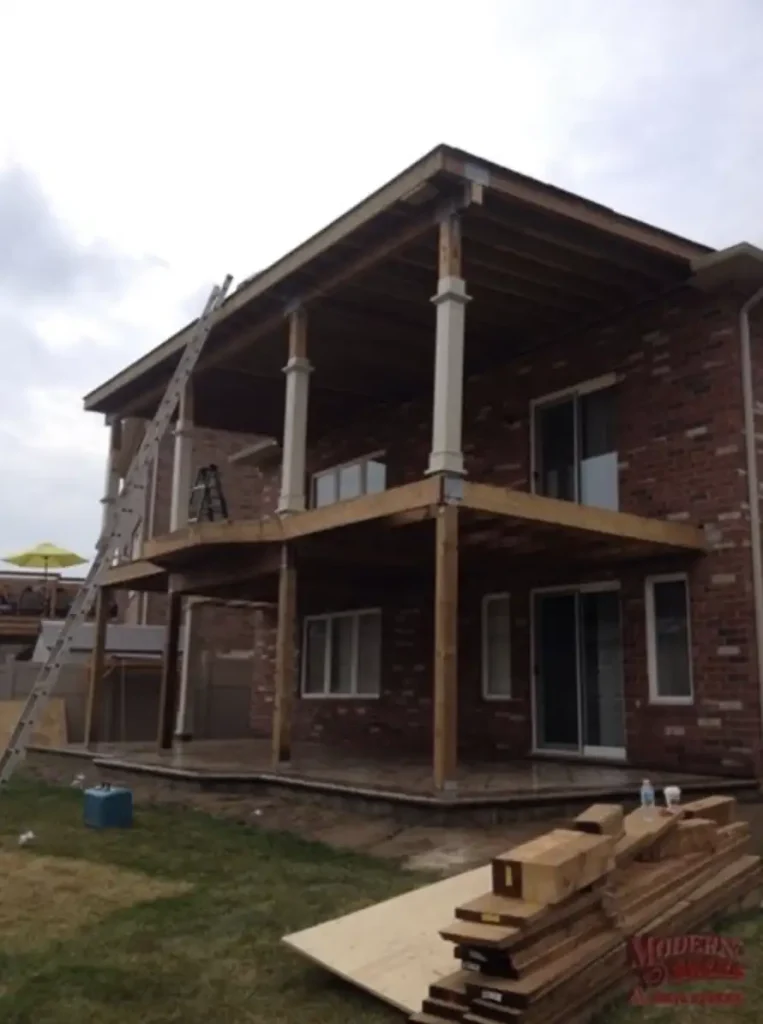 Professional deck framing and structural construction in progress for a residential project in Hamilton.