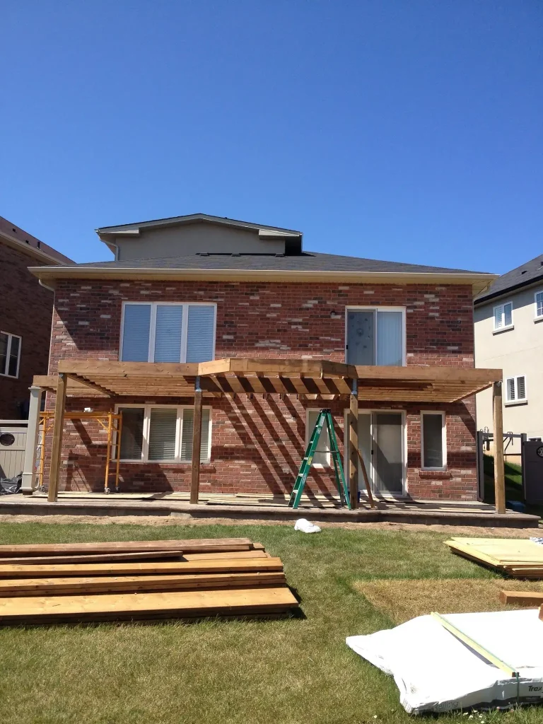 Front-angle view of a two-storey deck under construction in Hamilton