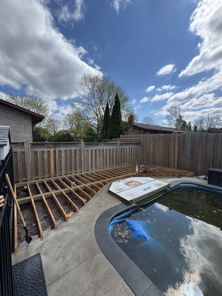 Custom-shaped multi-level deck construction and repair project showcasing complex carpentry in Bowmanville.