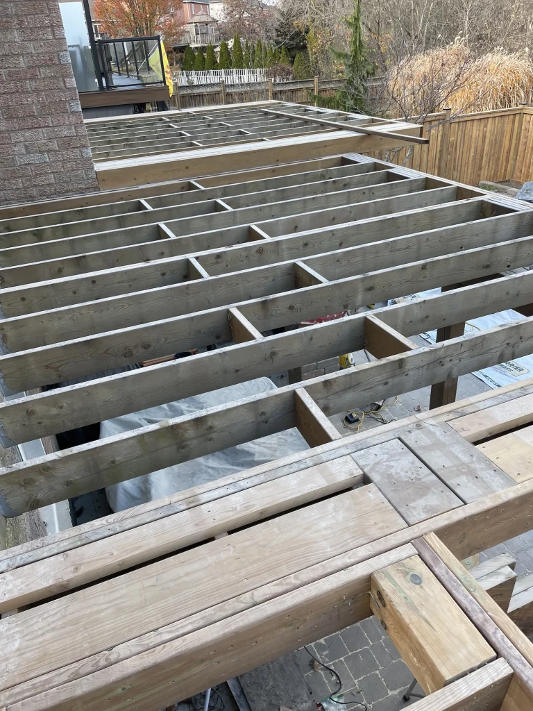 High-angle view of a completed custom deck in Bowmanville, highlighting the clean board layout and spacious design.