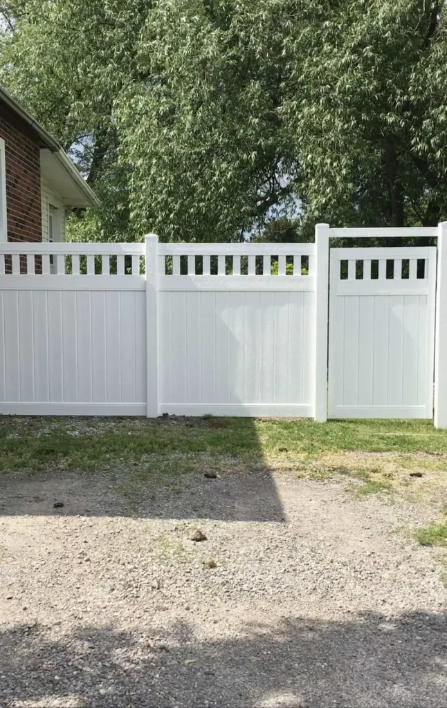 Versatile white vinyl fencing project in Bowmanville showcasing multiple sections and high-quality craftsmanship.