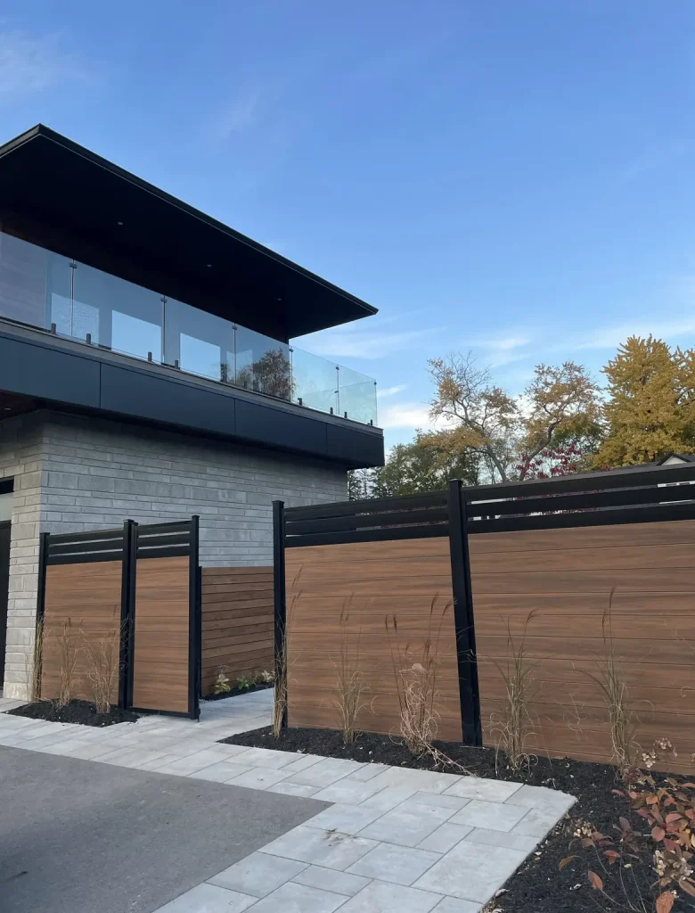 Side profile view of a high-quality vinyl privacy fence installation in a Burlington neighborhood.
