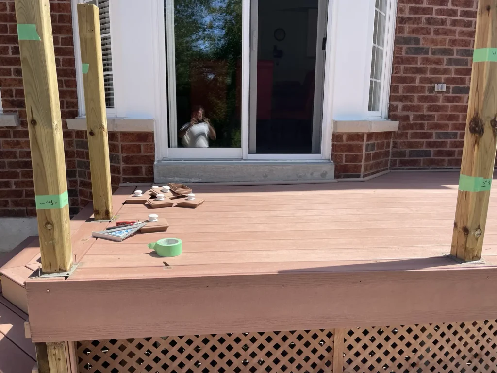 Mid-construction stage of a composite deck project in Ajax, showing the precise board layout and framing.