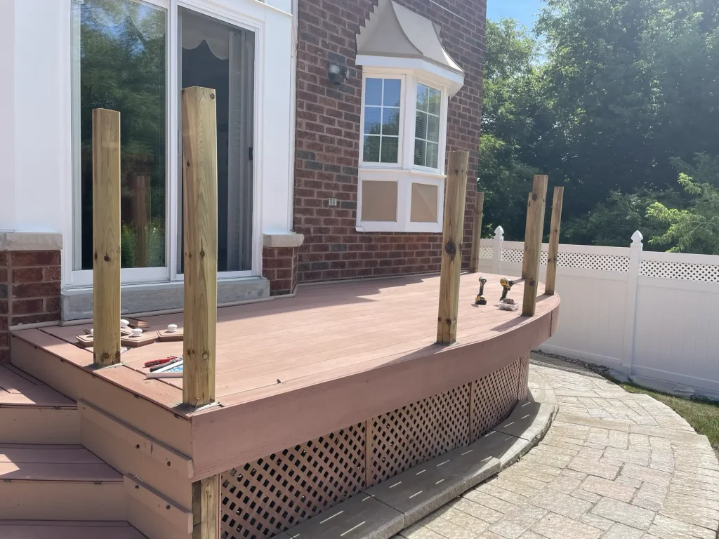 Secure mounting and installation of heavy-duty railing posts for a modern composite deck in Ajax.