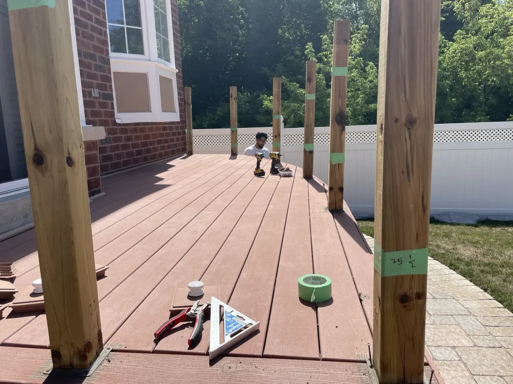 Structural preparation and blocking for a composite deck railing system installation on an Ajax property.