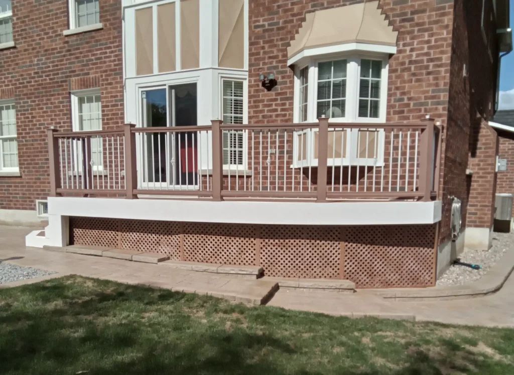Custom curved composite deck design showcasing expert craftsmanship for a residential backyard in Ajax.