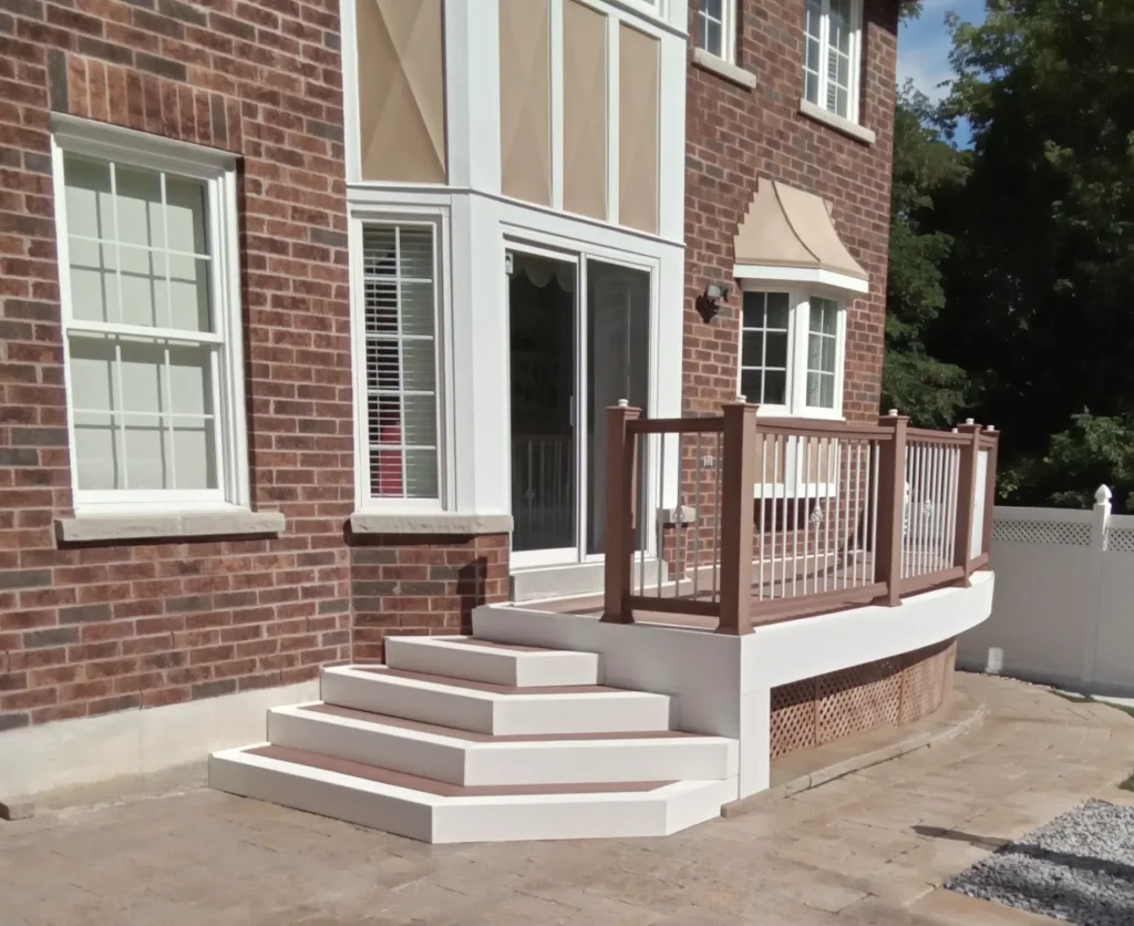 Completed composite deck stairs with high-quality trim and fascia board installation in Ajax, Ontario.
