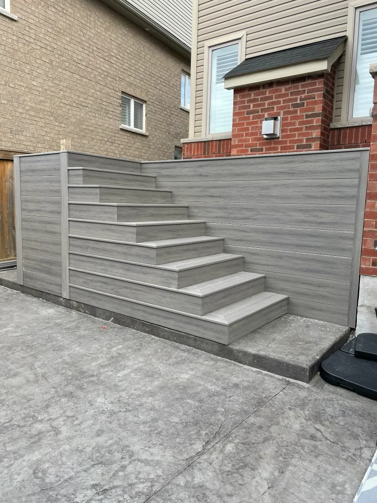 Elevated composite deck construction in Bowmanville, providing a durable and spacious raised outdoor living area.